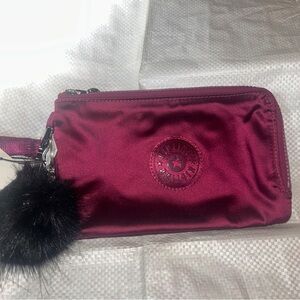 Kipling Maroon Wristlet with Pom Charm